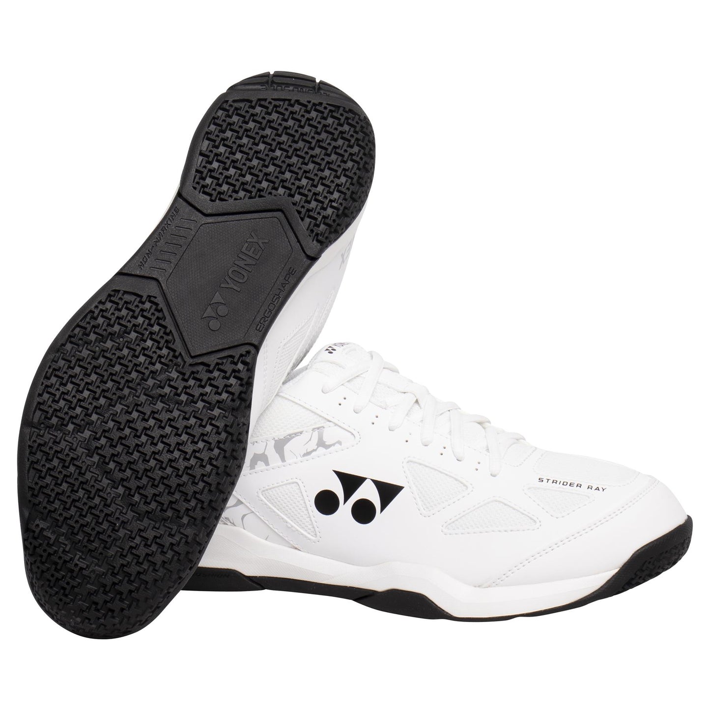 A pair of Yonex Power Cushion Strider Ray Men's Badminton Shoes in white, featuring black accents. One shoe stands upright, showcasing the side logo and "Strober Ray" text, while the other is flipped to reveal the gripped sole with Yonex branding. Ideal for badminton enthusiasts, thanks to its famed Power Cushion technology.