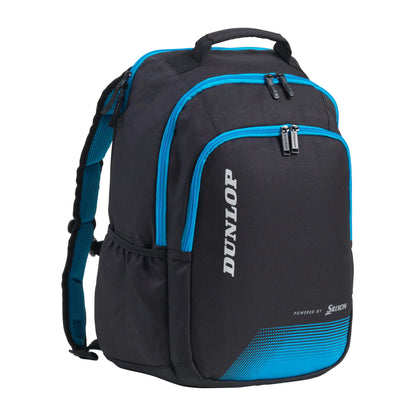 The Dunlop FX Performance Backpack - Black / Blue boasts numerous zipped compartments, a specialized pocket for rackets, comfortable padded shoulder straps, and convenient mesh side pockets. The front prominently displays the renowned Dunlop brand name in white.