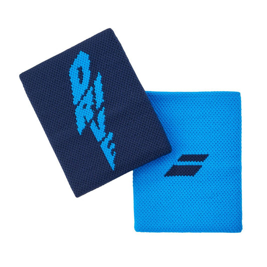 Two blue wristbands are on display. The one on the left is a dark blue, high-absorption Babolat Logo Jumbo Wristband in Drive Blue with "Dale" embroidered in light blue. On the right is a light blue wristband featuring Babolat's small, distinctive dark blue two-stripe logo. Both tennis accessories feature textured fabric designed for enhanced performance.