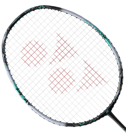 A close-up of a Yonex Astrox 88 Play 4U Gen 3 2024 badminton racket's head highlights its red strings and impressive ISOMETRIC design, with the frame showcasing a gleaming silver finish complemented by sleek black accents.