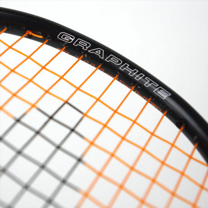 A close-up displays an isometric view of the Karakal BZ 30 2.1 Badminton Racket with orange strings and a black frame, featuring the word "GRAPHITE" in white letters. The light-colored background accentuates its sleek design.