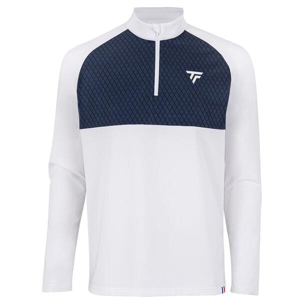 Introducing the Tecnifibre Men's Thermo Badminton Zipper Longsleeve in white, this stylish pullover features a half-zip design with raglan sleeves. The dark blue geometric pattern enhances the upper chest, complemented by the exclusive Tecnifibre Thermo Zipper. A small logo is elegantly placed on the right chest, and a vibrant color-striped detail embellishes the bottom hem.