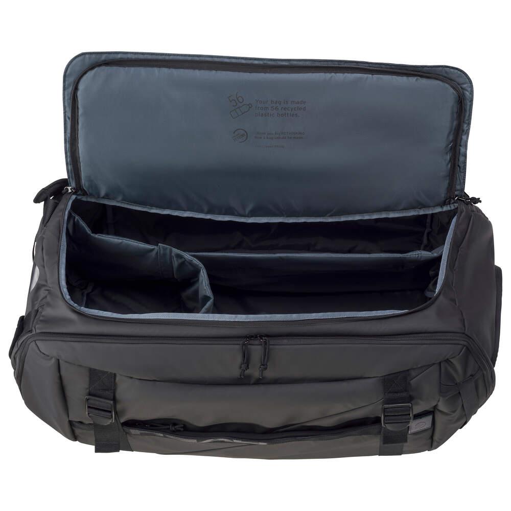 The HEAD Pro X Duffle Bag XL - Black features a stylish black design crafted with eco-friendly materials. When looked at from above, the interior displays a gray lining, two dividers, and a zippered pocket located inside the lid.