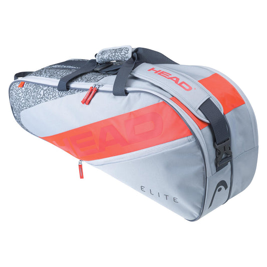 The HEAD Elite 6R Combi 6 Racket Bag in Grey and Orange offers a practical carry system with several compartments, shoulder straps, and a zipper. It prominently displays the HEAD brand's logo and includes a patterned handle for convenient transport of your gear.