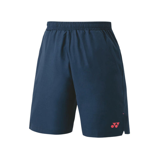 The Yonex 15165 Men's Badminton Shorts in Indigo Marine feature an elastic waistband and convenient side pockets. A subtle red logo is placed on the lower left leg. Crafted from lightweight fabric with VeryCool technology for ultraviolet reduction, they are ideal for both sports and casual wear.