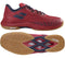 Introducing the Babolat Shadow Spirit 2 Men's Badminton Shoes in Black and Poppy Red. These lightweight athletic shoes feature a textured upper with a gum-colored sole and distinctive tread pattern, prominently displaying the Michelin logo on both the side and sole. Positioned to showcase both the side view and the sole, they offer optimal comfort for badminton players.