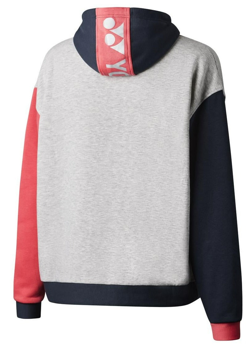 The Yonex YHD123 Unisex Badminton Hoodie, in Grey, Gunmetal, and Cerise, offers premium comfort with its stylish color-blocked design. It features a gray body complemented by one red sleeve and one black sleeve. The hood is accented with a red stripe that displays the white Yonex logo and text, embodying sportswear fashion.