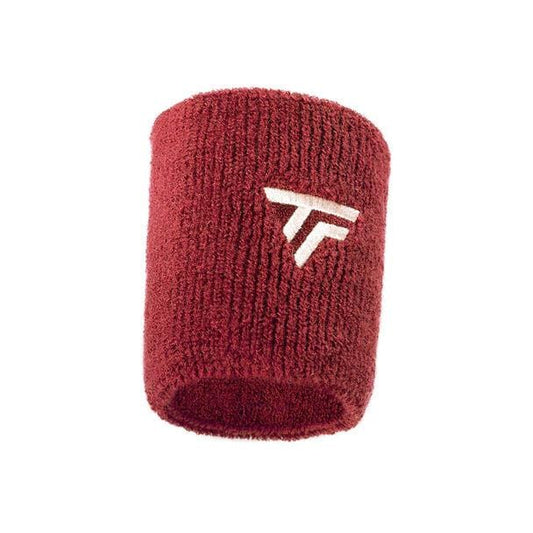 The Tecnifibre Wristband Sweatband XL in Cardinal is a bold red accessory featuring a textured surface with an embroidered white "TF" logo. Made to be highly absorbent, this wristband effectively manages moisture during intense workouts.