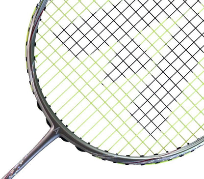 Close-up of the Ashaway Phantom Shard 4 4U Badminton Racket – Yellow, highlighting its round frame and tight strings in black and green with Shardtech technology. The partially visible handle is at the bottom.