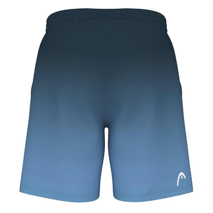 The HEAD Vision Power II Men's Badminton Shorts in Navy/Blue showcase a captivating gradient design that shifts from dark blue at the waistband to a lighter shade of blue at the hem. These shorts are equipped with 4-way stretch fabric and feature Moisture Transfer Microfiber technology, along with a small white logo positioned near the bottom on the right side.