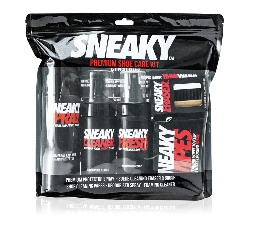 The Sneaky Complete Shoe Cleaning Kit, a product by the Sneaky brand, includes various items such as the Sneaky Spray Protector, wipes, and erasers, all organized in a clear bag. This "Premium Shoe Care Kit" guarantees that your shoes maintain their pristine appearance.