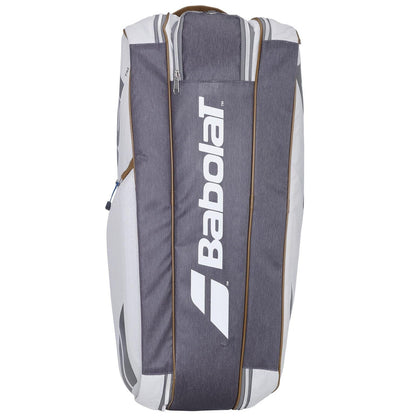 The Babolat RH6 Pure Wimbledon 6 Racket Badminton Bag in gray, with the brand logo displayed vertically, is an ideal choice for tennis players. This bag offers multiple zippered compartments and padded straps, making it expertly designed to carry your tennis gear comfortably.