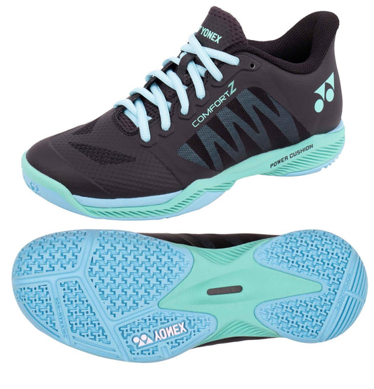 Introducing the Yonex Power Cushion Comfort Z3 Wide Men's Badminton Shoes, a stylish pair in black and mint. Designed for optimal performance on the badminton court, these shoes feature laces, a side logo, and a textured mint sole for superior grip. The distinctive "Comfort Z3" marking draws inspiration from Yonex's renowned Power Cushion technology.