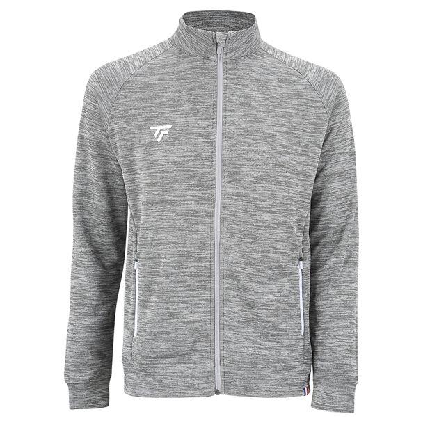 The Tecnifibre Men's Team Badminton Jacket in silver is a zip-up athletic garment featuring a high collar and subtle horizontal pattern. Made from breathable and stretchy polyester double mesh fabric, it has a small white Tecnifibre logo on the left chest, along with white accents on the zippers of its two side pockets.