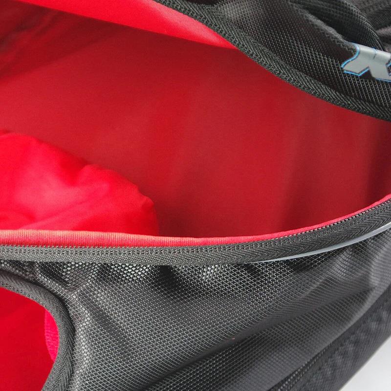 A close-up of the Karakal Pro Tour 30 2.1 Badminton Backpack reveals its vibrant interior lining, contrasting with the sleek black and blue fabric. The detailed stitching and zipper add a touch of rugged elegance to this versatile sports bag.