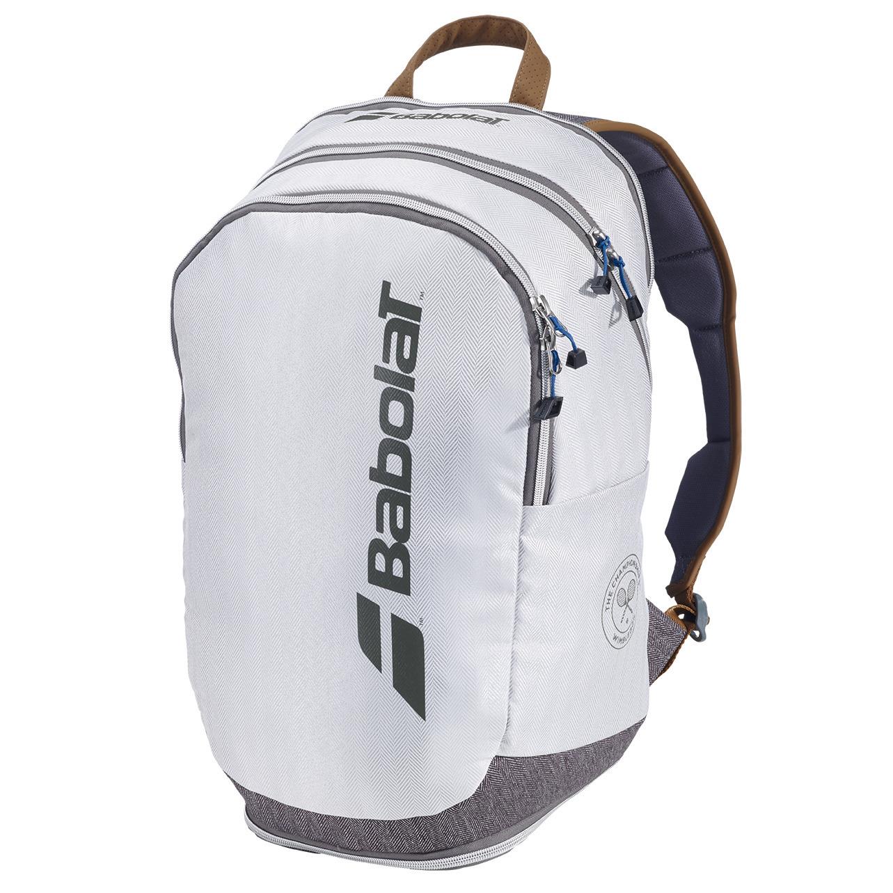 The grey Babolat Wimbledon Court Badminton Backpack features multiple zippered compartments and a stylish black logo. With its padded back and brown handle, this essential item for badminton players keeps racquets and gear organized in style. A perfect addition to any collection of Babolat bags.