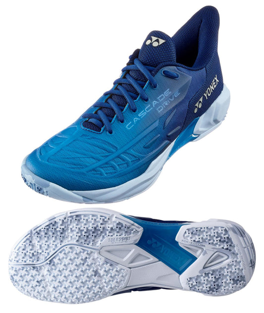 The Yonex Power Cushion Cascade Drive 2 Badminton Shoes in Clear Blue showcase the brand's imprinted name and feature a textured sole. The top shoe presents a side view with "Cascade Drive" displayed prominently, emphasizing its Power Cushion technology, while the bottom shoe reveals the tread pattern.