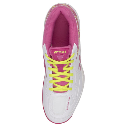 A top view of the Yonex Power Cushion Strider Ray Women's Badminton Shoes displays a white and pink color scheme, highlighted by yellow laces. The shoe prominently features "STRIDERRAY" on the side and the Yonex logo on its tongue, enhanced with a Radial Blade Sole for superior grip and Power Cushion technology for exceptional comfort.