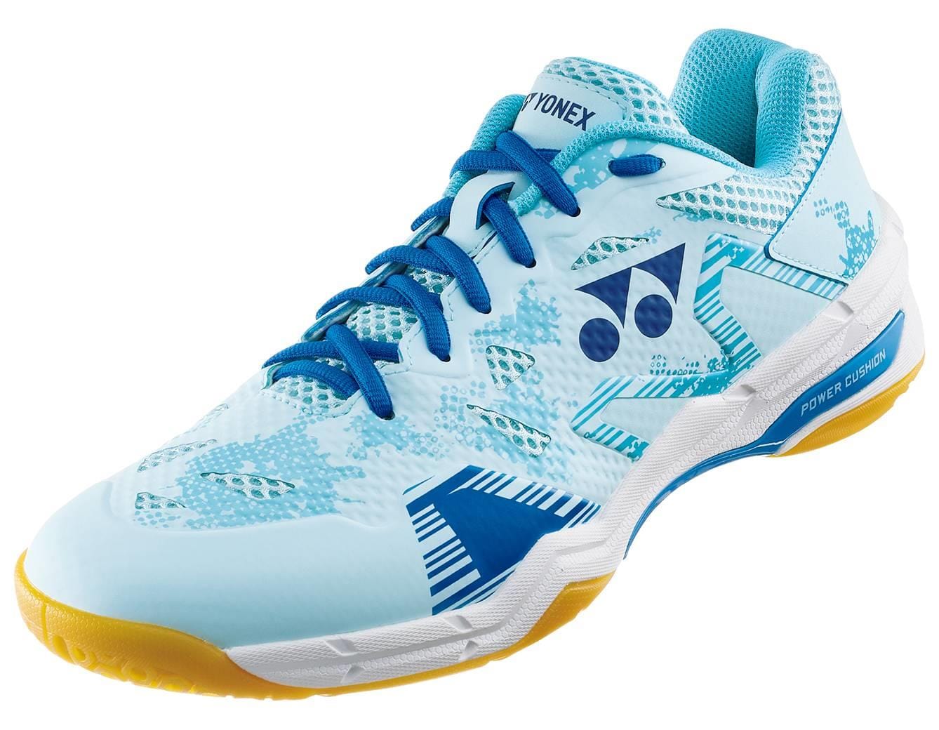 The Yonex Power Cushion Eclipsion X3 Men's Badminton Shoes in light blue feature blue laces and a white sole with yellow accents. These indoor court shoes exhibit a patterned design, complete with branding on the side and tongue, making them perfect for badminton enthusiasts.