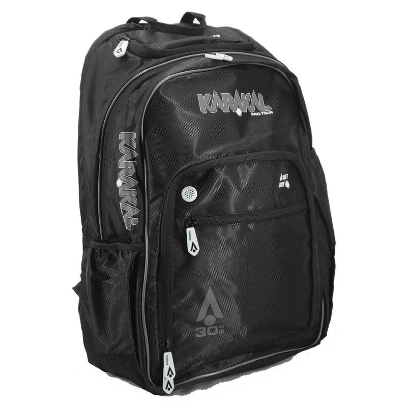 The Karakal Pro Tour 30 2.1 Badminton Backpack in Black/White offers multiple zippered compartments, padded shoulder straps, and convenient side pockets. It features white logos and accents, including the number "30" on the front, making it an ideal choice for sports or travel with its practical wet/dry compartment.