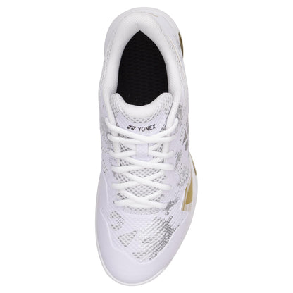 Top view of a Yonex Power Cushion Eclipsion Z3 Men's Badminton Shoe in white with gray and gold accents, showcasing a textured pattern and equipped with white laces. The shoe's interior is lined in black. Enhanced with Yonex Power Cushion technology, it provides exceptional comfort and stability on the court.