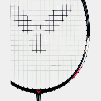 Close-up of a Victor Thruster K11 C 4U Badminton Racket head with black strings in a V pattern. The frame is lightweight and black with red accents, enhancing its flexible shaft for optimal swing freedom.