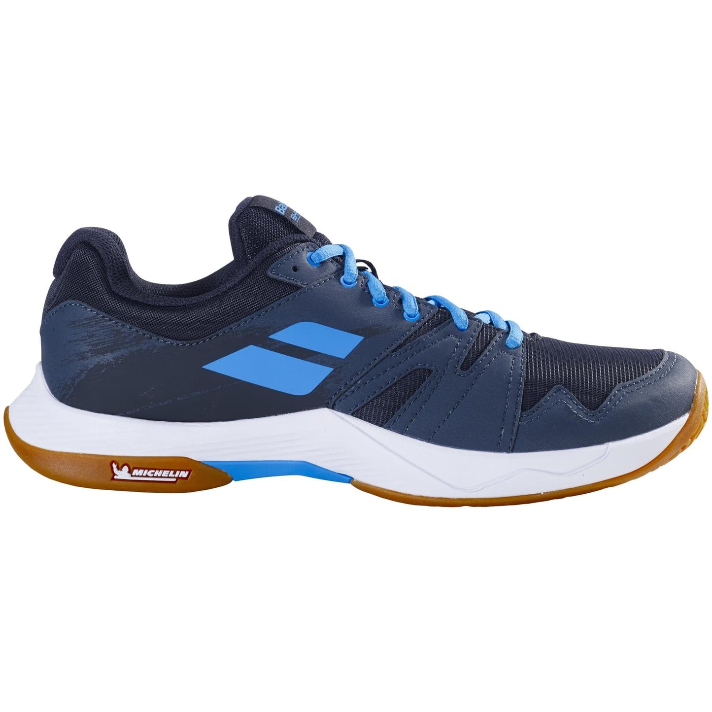 A single Babolat Shadow Team 2 men's badminton shoe in black and grey, featuring a white sole and gum-colored outsole. This model highlights the Michelin logo on the midsole to ensure enhanced grip and durability using Michelin rubber technology.