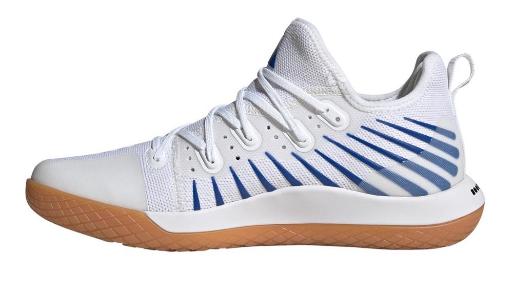 The ADIDAS Stabil Next Gen Primeblue men's badminton shoes, offered by adidas, boast a stylish cloud white color with core black accents. Designed for indoor court sports like badminton, these shoes feature a mesh upper with blue stripe details and a tan rubber sole. They incorporate BOOST technology to enhance comfort and include a lace-up design along with a convenient pull tab at the heel. The side profile of the shoe is particularly sleek.