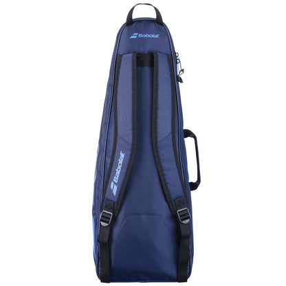 The dark blue Babolat Backrack 3 Badminton Bag, made by Babolat from recycled polyester, includes shoulder straps and a side handle for convenient transportation. Designed to accommodate multiple rackets, it features a sleek and elongated shape.