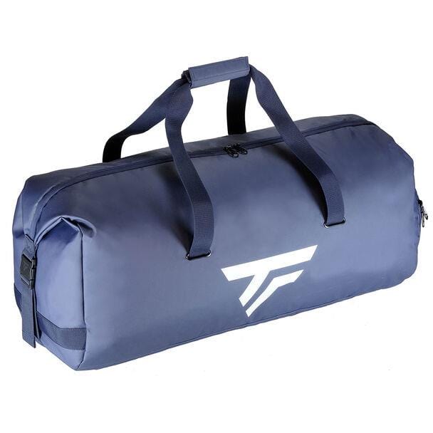 The Tecnifibre Tour Endurance 2023 Badminton Rackpack is a spacious navy blue bag with black handles and a zipper closure, ideal for badminton enthusiasts. It features a white geometric logo on its side for added style.