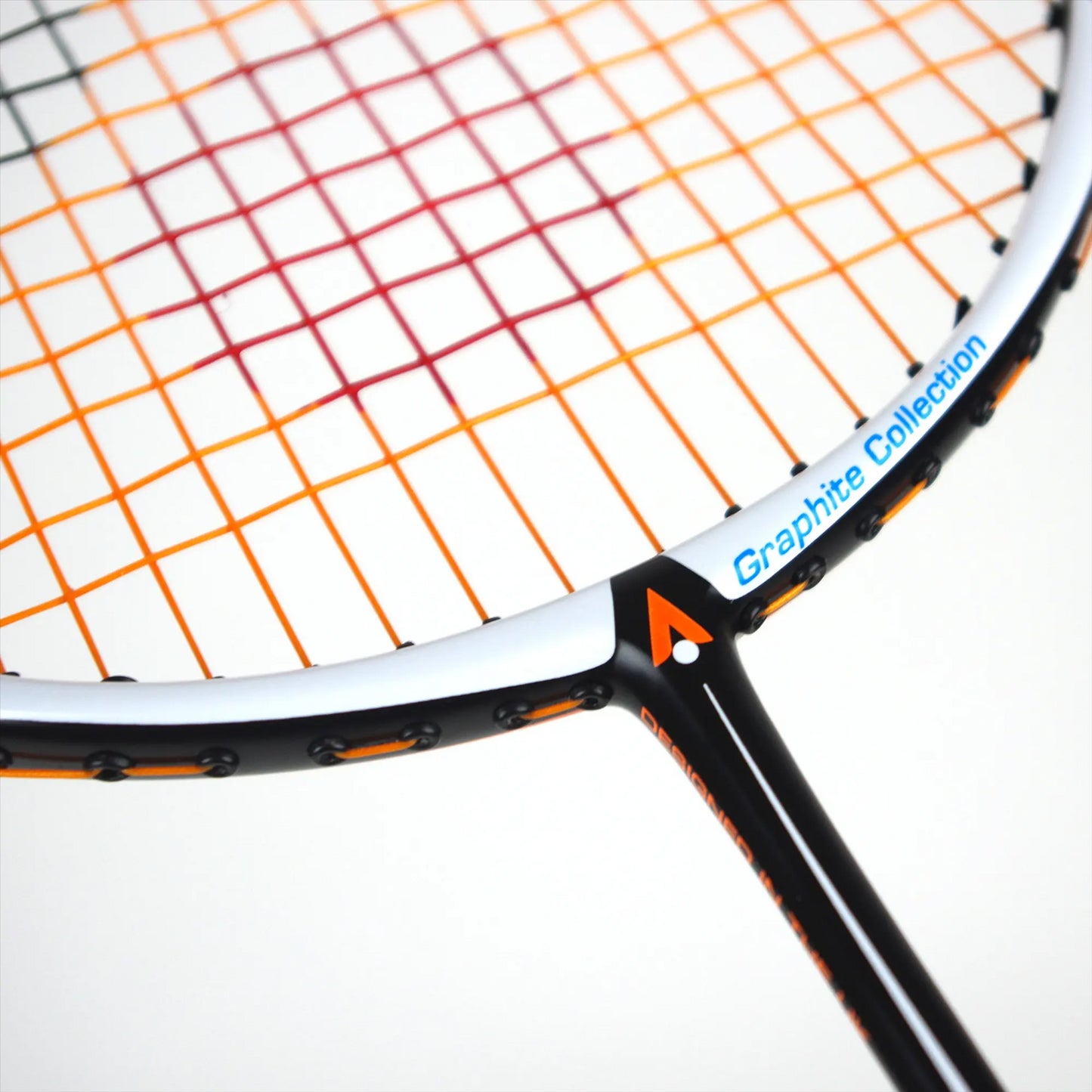 Close-up of a badminton racket showcasing multicolored strings in orange, red, and pink. The black frame features orange detailing and an isometric head labeled "Graphite Collection" in white and blue text. The racket is the Karakal BZ 30 2.1 model by Karakal.