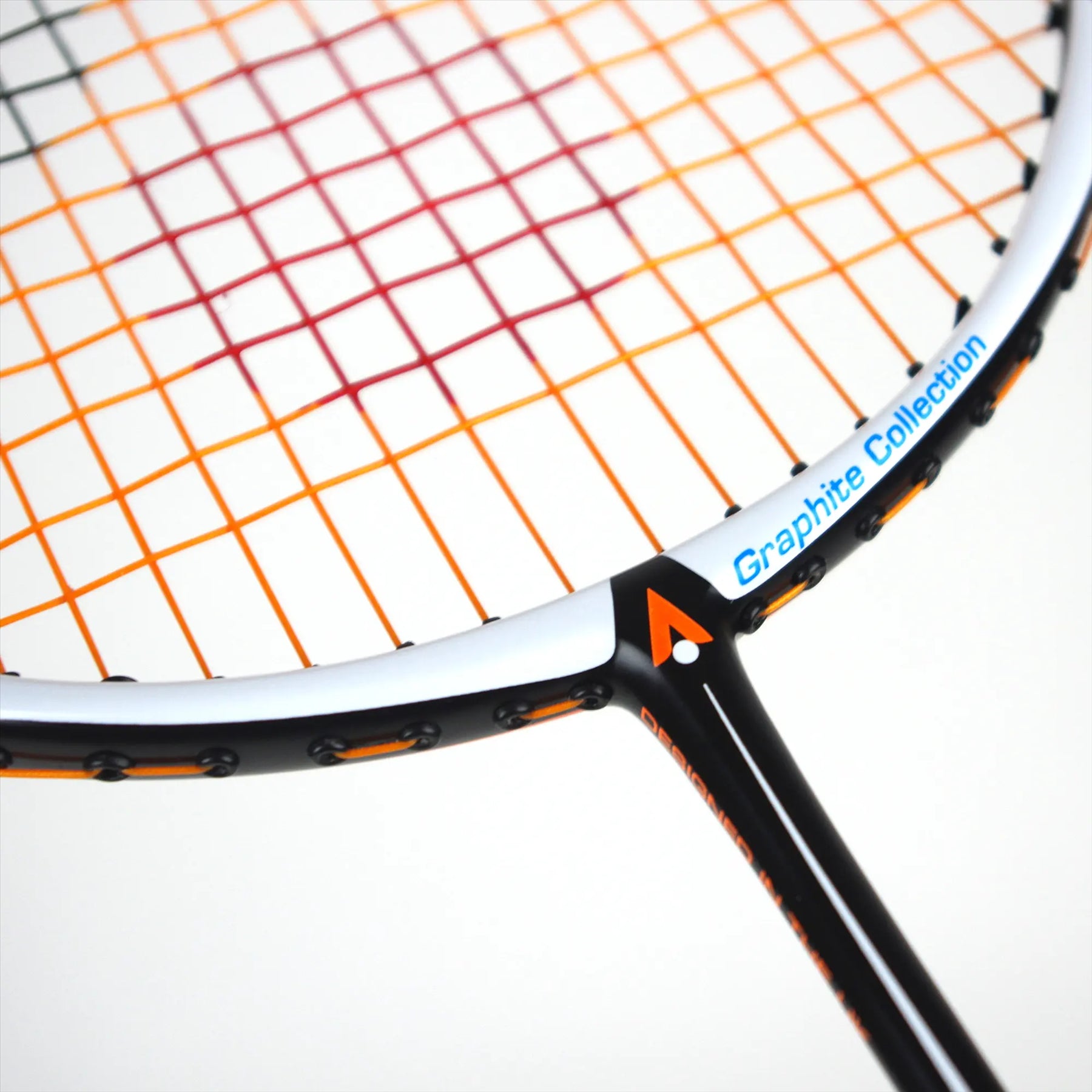 Close-up of a badminton racket showcasing multicolored strings in orange, red, and pink. The black frame features orange detailing and an isometric head labeled "Graphite Collection" in white and blue text. The racket is the Karakal BZ 30 2.1 model by Karakal.