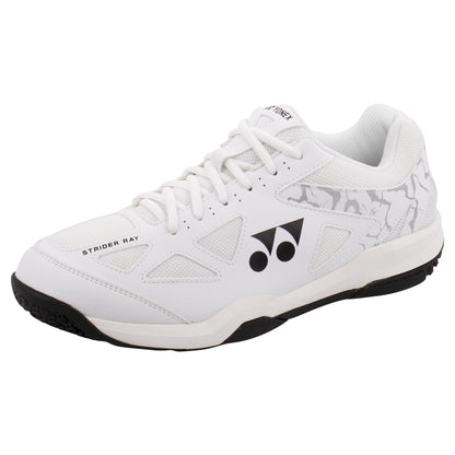 The Yonex Power Cushion Strider Ray Men's Badminton Shoes boast a sleek white athletic design complemented by black accents and a sturdy black sole. Sporting a geometric pattern and the Yonex logo, these shoes are equipped with white laces and feature intricate patterned detailing near the heel. With Power Cushion technology, they offer exceptional support for dynamic movements on the court.