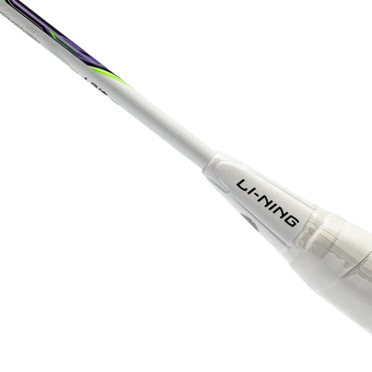 A close-up of the Li-Ning Halbertec Motor 4U Badminton Racket - White showcases its handle featuring a purple and green design on the shaft, ideal for enhancing performance. The brand name "Li-Ning" is prominently printed in black on the handle. The white background accentuates its sleek appearance.