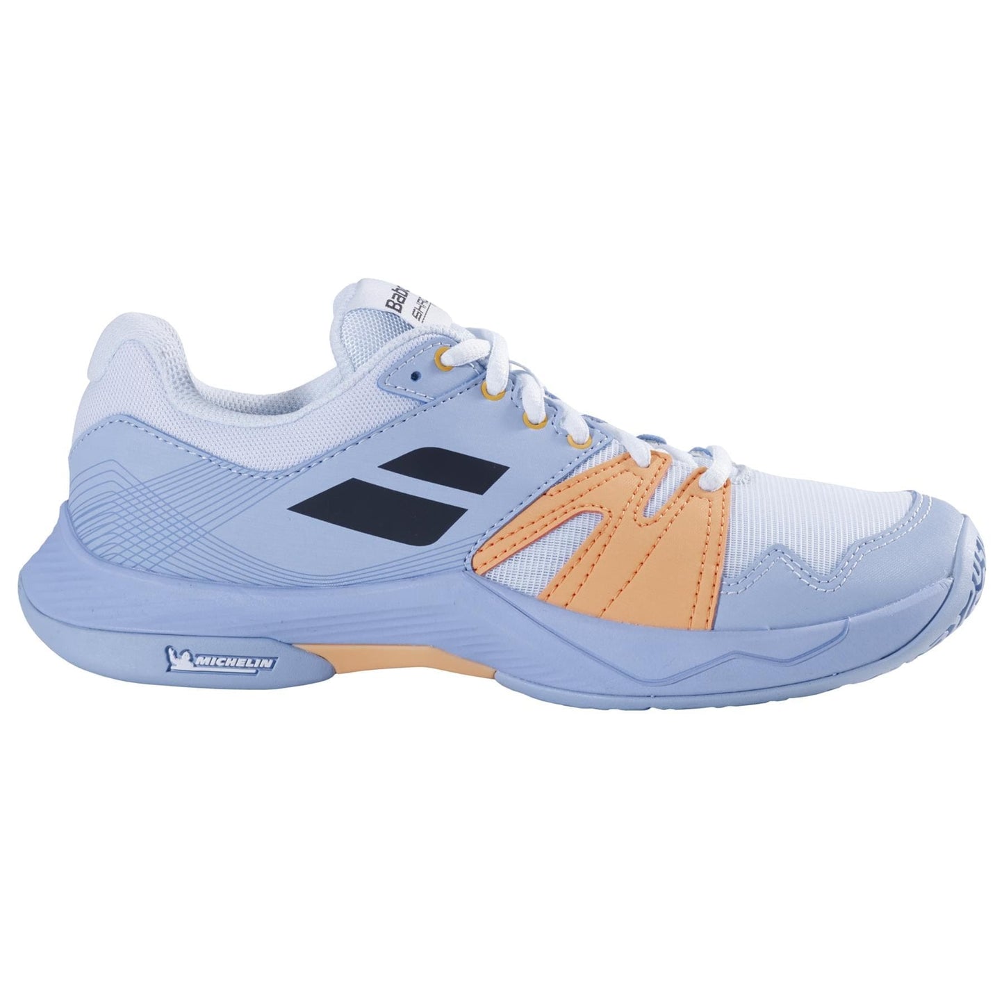 The Babolat Shadow Team 2 Women's Badminton Shoes in light blue feature vibrant orange accents and a white sole, highlighted by a dark blue Babolat logo on the side. Designed for athletic activities, these shoes include Michelin rubber for exceptional durability, white laces, and a supportive structure.