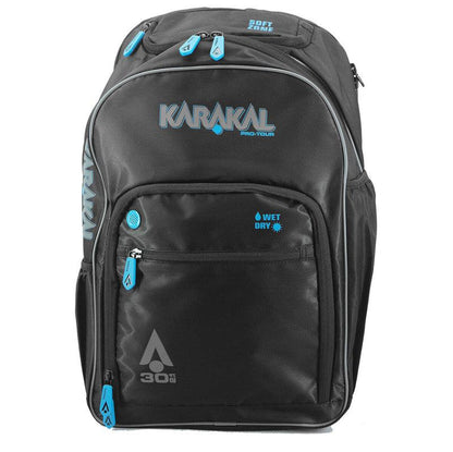 The Karakal Pro Tour 30 2.1 Badminton Backpack in Black and Blue showcases blue zippers and accents, featuring multiple compartments such as a soft zone and a wet/dry section, with its 30-liter capacity prominently displayed on the front.