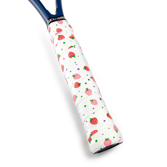 The Get A Grip Strawberries & Cream Badminton Overgrip in white, a product from the brand Get A Grip, features premium grip tape adorned with colorful strawberry and dot patterns. It offers outstanding moisture absorption, while the blue frame subtly exposed beneath adds an element of elegance typical of high-quality badminton overgrip designs.