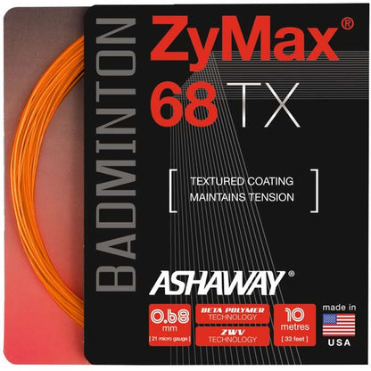 The image displays the Ashaway Zymax 68 TX Badminton String Orange packaging, highlighting its BETA polymer fibers and ZyWeave string technology. The package underlines features such as a textured coating, outstanding tension maintenance, with specific details of a 0.68 mm thickness and a 10-meter length, made in the USA.