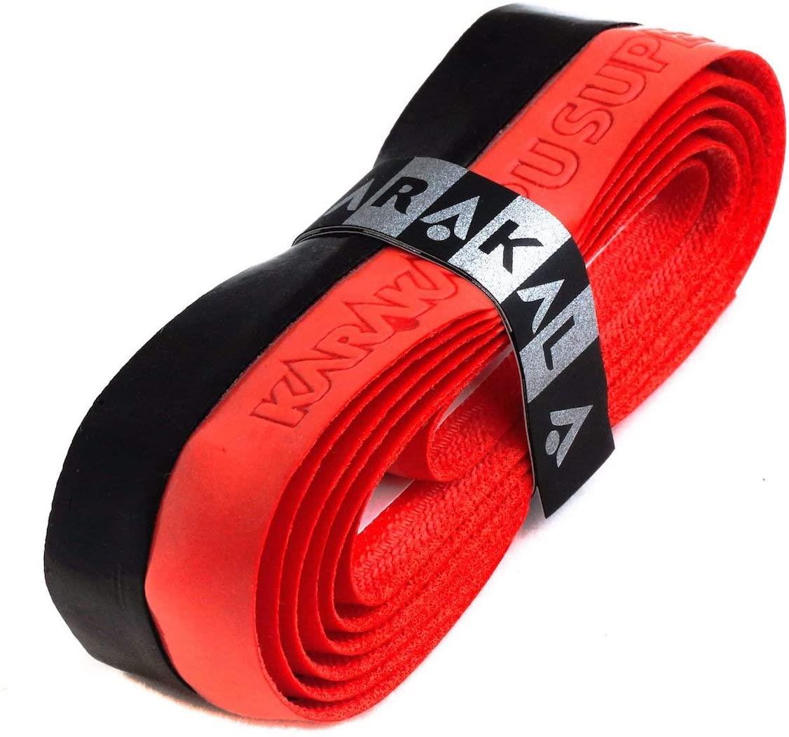 Close-up of a rolled Karakal PU Badminton Duo Super Grip Single in black and red, featuring embossed text. This replacement grip is secured by a silver band displaying the Karakal brand name, making it ideal for enhancing your racket sports experience.