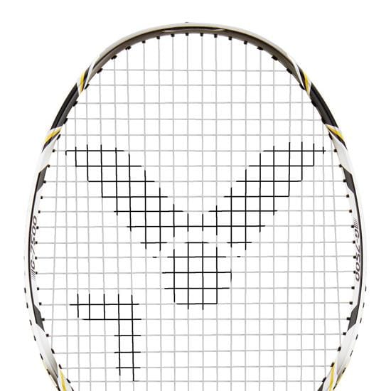 Close-up of the Victor G-7500 Badminton Racket - Black, focused on the head featuring a black logo design on Ashaway Rally 21 Fire strings. The frame is predominantly white with black and yellow highlights, making it an ideal full carbon beginner racket.