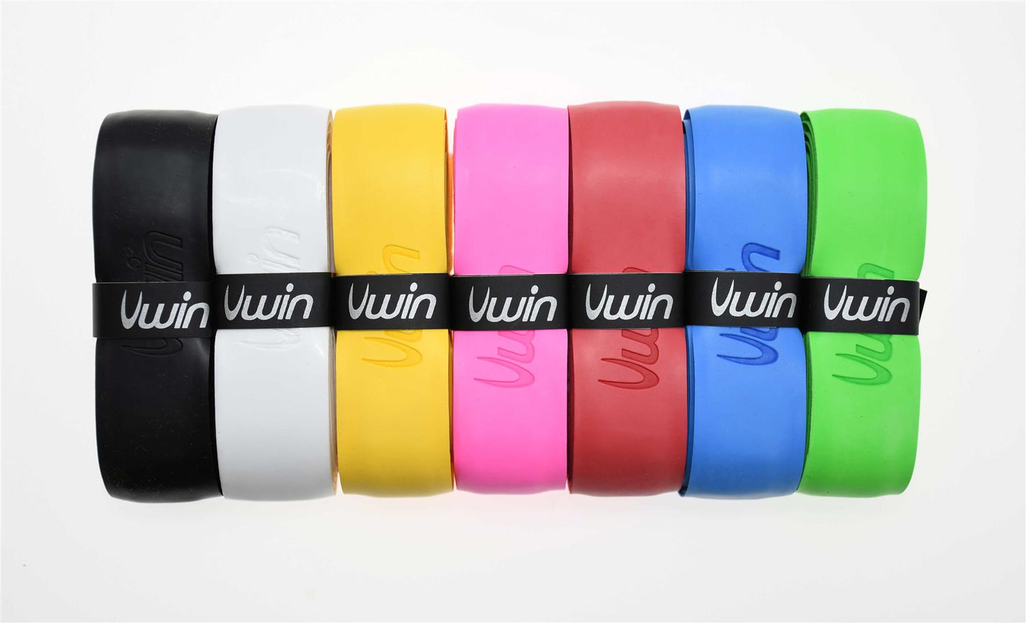 A set of seven durable silicone wristbands in colors black, white, yellow, pink, red, blue, and green are arranged horizontally. Each band bears the "Uwin" logo in its respective color. These bands serve as a trendy accessory or can double as an improvised badminton grip.