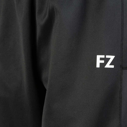 Close-up of the FZ Forza Plymount Women's Badminton Pants in black, showcasing "FZ" printed in white letters. These pants embody Danish design with their smooth, quick-drying fabric, perfect for comfortable badminton wear.