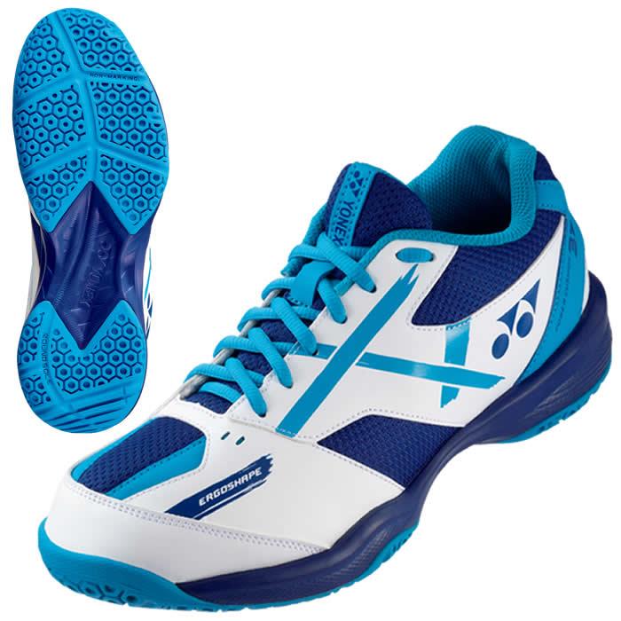 Introducing the Yonex Power Cushion 39 Junior Badminton Shoes in White and Blue. These athletic shoes feature a dynamic design with a textured sole for enhanced grip. Highlighted by blue laces and the Yonex logo, an inset image showcases the intricate sole pattern, ideal for young athletes on the court.