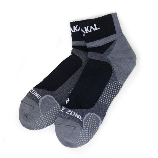 Introducing the Karakal X4 Men's Technical Ankle Badminton Socks in Black/Grey (UK7-UK13), featuring anti-slip rubber dots and shock-absorbing technology. Designed with textured soles, contrasting panels, and white text on the cuffs and toe area for ultimate comfort and support.