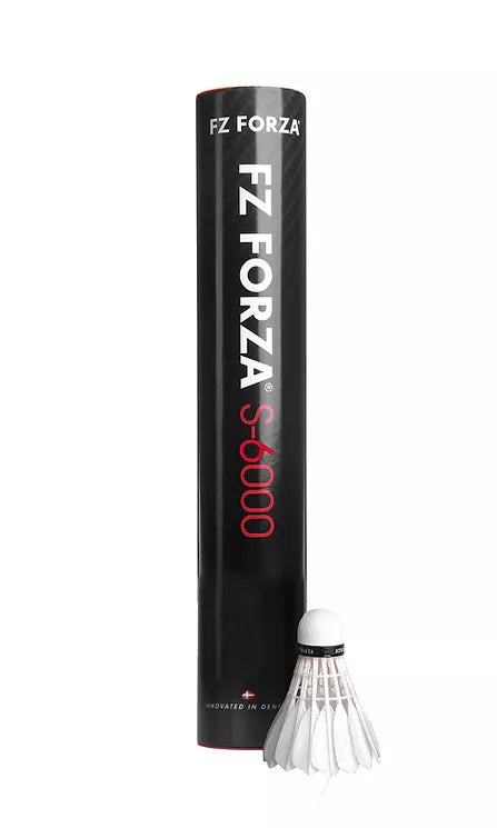 A black cylindrical tube labeled "FZ Forza S6000" stands upright, accompanied by a white FZ Forza club level feather shuttlecock. The bold white and red lettering on the tube draws attention. Renowned for its excellent flight and durability, the shuttlecock is positioned in front of the tube.