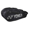 Yonex's 6 Piece Pro Badminton Racket Bag 92226 in black showcases a sleek, streamlined design with a prominent logo on the side. This multi-functional bag includes an integrated shoe pocket, multiple compartments, handles, and an adjustable shoulder strap for ultimate convenience.