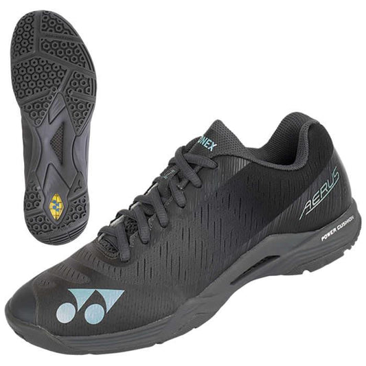 These stylish and contemporary Yonex Power Cushion Aerus Z women's badminton shoes in Dark Grey have a textured sole and black shoelaces. Featuring the "Aerus" branding and equipped with "Power Cushion" technology, they also include a subtle blue logo on the toe area, combining both style and performance on the court.