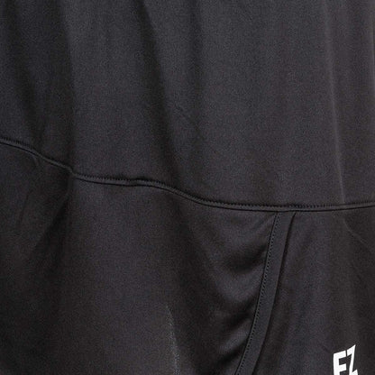 A close-up view of the FZ Forza Liddi 2 in 1 Women's Badminton Skirt showcases its meticulous Danish design, with stitching details and a small white "EZ" label at the bottom. The black fabric is smooth, slightly textured, and features a quick-drying capability for enhanced comfort.