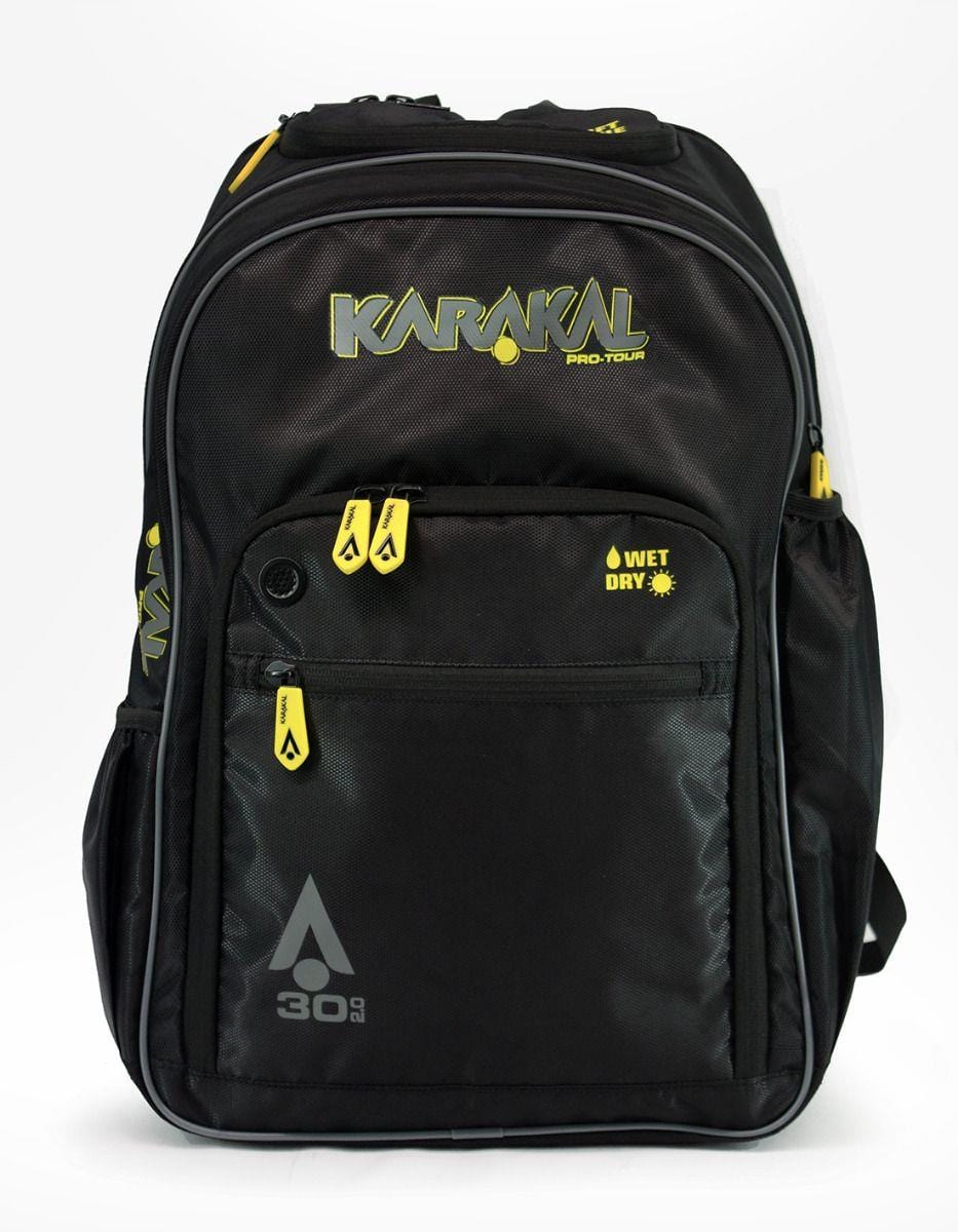 The Karakal Pro Tour 30 2.0 Badminton Backpack - Black, by Karakal, boasts multiple zippered compartments, including a large front pocket labeled "Wet Dry," and a smaller one with a "30 g" logo. Its sleek and functional design makes it ideal for avid players on the go.