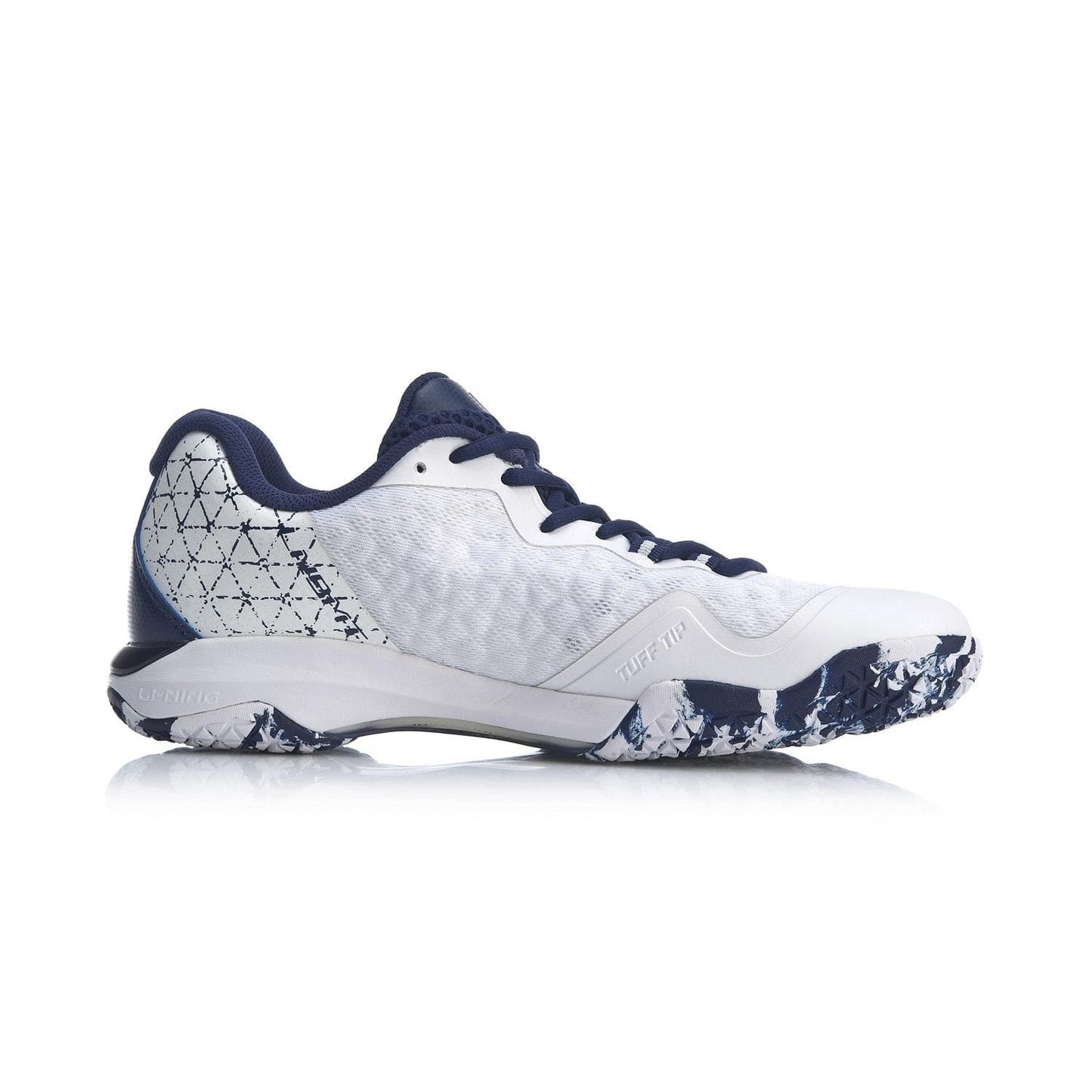 Side view of the Li-Ning Dagger II SE Mens Badminton Shoes in white, showcasing navy blue accents. These shoes are perfect for badminton with their patterned heel design and textured sole in white and blue. Featuring TUFF-TIP technology for added durability, the laces and inner lining are a consistent navy blue, maintaining a sleek athletic look.